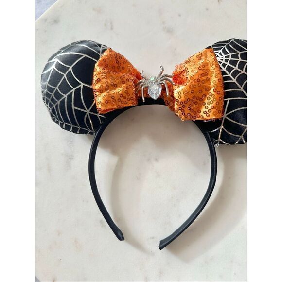 Disney’s Minnie mouse spiderweb and sequin orange bow ears
